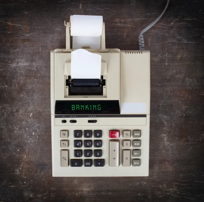 Old calculator showing a text on display - banking